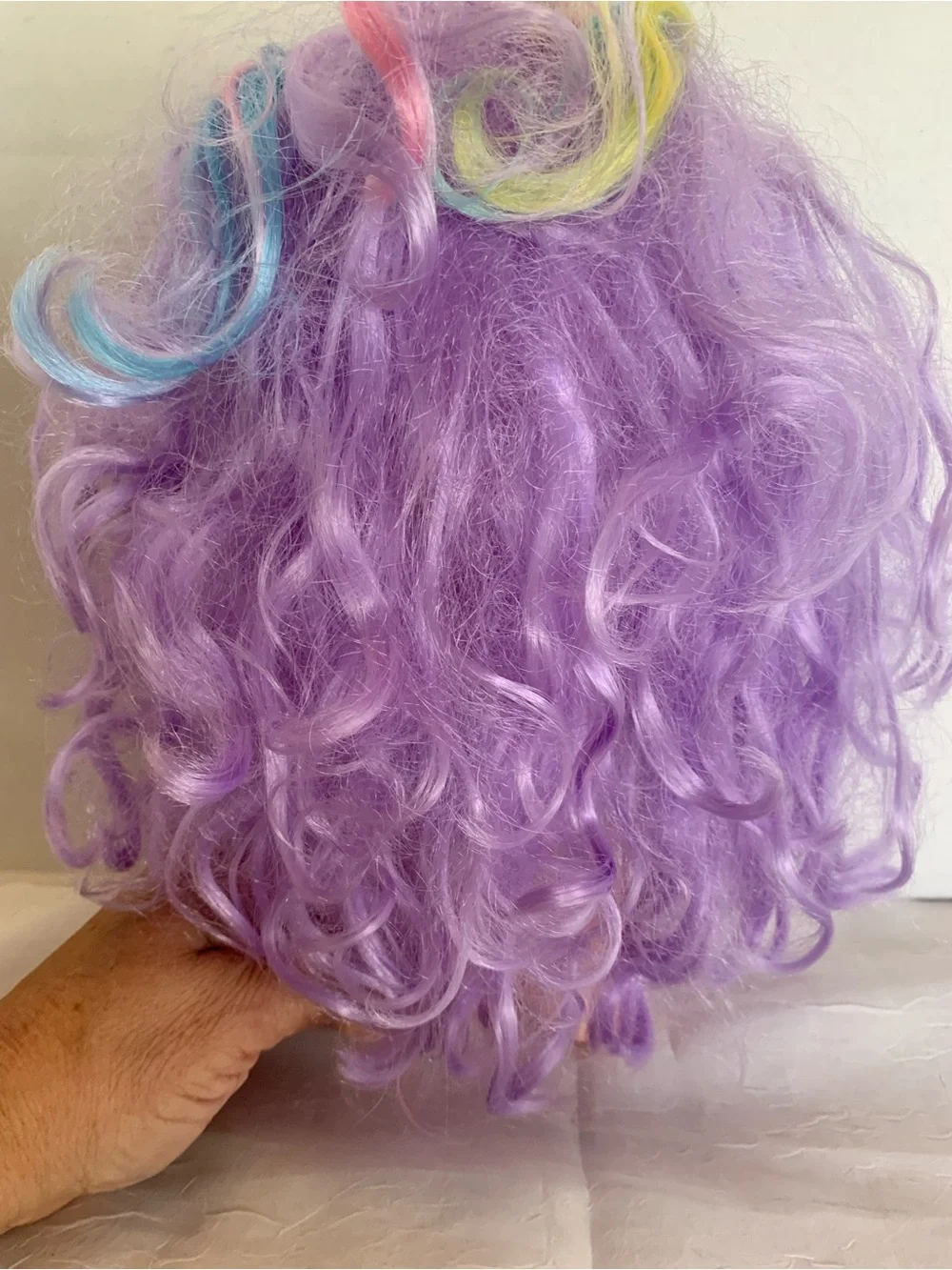 Kindi Kids Rainbow Kate doll with pastel hair and large glitter eye